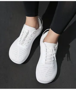 Top-down view of kids' white barefoot shoes with quick-lace mesh and non-slip sole