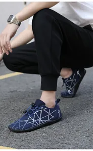 Detail of blue breathable mesh outdoor barefoot shoe with silver geometric patterns