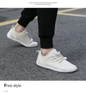 Outdoor view of beige wide toe barefoot shoes with breathable mesh and quick laces