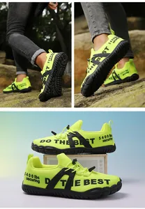 Macro shot of neon green wide-toe hiking shoe with quick-lace system and grippy rubber sole