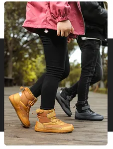 Detail of children's winter boots with warm faux fur lining and anti-slip rubber soles