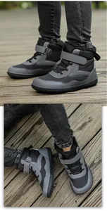 Detail view of children's waterproof snow boots with hook-and-loop straps and warm lining