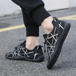 Black barefoot hiking shoes with reflective silver patterns and non-slip rubber outsoles
