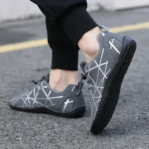 Dark grey barefoot sneakers with wide toe box and flexible grip rubber sole