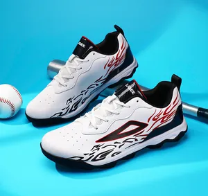 Detail of white soccer shoes with red and black flame patterns and carbon fiber texture