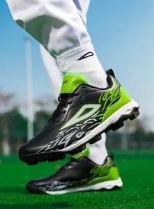Detail of multi-ground turf soccer shoes in black and neon green with silver flame patterns