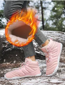 Detail of pink waterproof snow boot with thick faux fur lining for extreme warmth