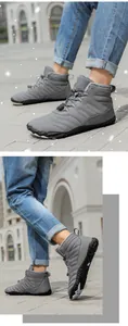 Macro view of grey waterproof snow boots featuring warm fleece lining and non-slip rubber soles