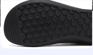 Detail of black rubber outsole with anti-slip hexagonal honeycomb grip pattern