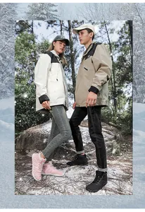 Outdoor couple wearing waterproof snow boots and thermal jackets in a winter forest scene