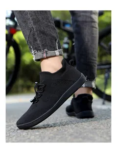 Detail of black knit barefoot sports shoe with adjustable elastic toggle and rubber sole
