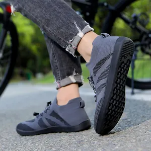 Dark grey knitted barefoot sports shoe with non-slip rubber sole for hiking