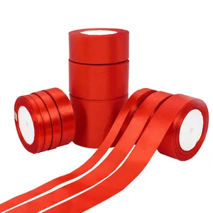 Rolls of shiny red satin ribbon in various widths for gift wrapping and festive decoration