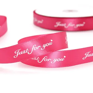 Hot pink satin ribbon with Just for you print and heart motifs for gift wrapping