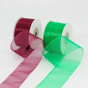 Sheer burgundy and green chiffon organza ribbons on rolls for gift wrapping