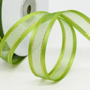 Transparent green organza ribbon with gold metallic edges for gift and flower wrapping