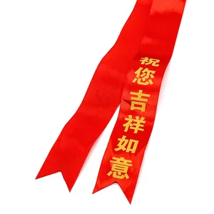 Red ceremonial satin ribbon with gold Lucky Wishes text and fishtail ends for events