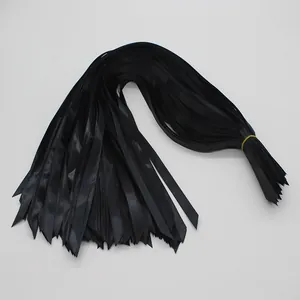 Bundled black satin ribbons with diagonal cut ends for gift packaging and DIY crafts