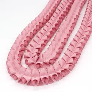 Pink pleated ruffle ribbon 2.5cm wide with fine ribbed texture for DIY craft projects