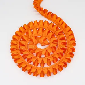 Bright orange ruffled satin ribbon with center pleated design for DIY sewing and crafts