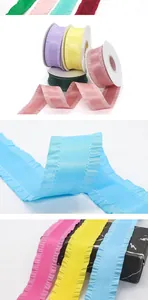 Close-up of multicolored 4cm ruffled polyester ribbons with smooth satin finish and pleats