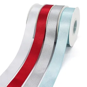 Set of four shimmering 2.5cm ribbons in silver, red, grey and blue for gift packaging