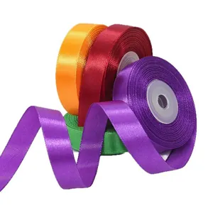 Colorful 1.5cm satin ribbons for gift wrapping and wedding decor on white background