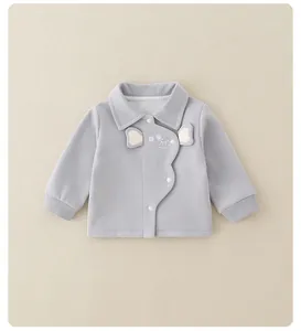 Close-up of grey cotton baby cardigan featuring cute mouse embroidery and wave trim