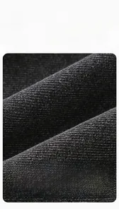 Detail of skin-friendly dark grey combed denim fabric showing texture and soft finish