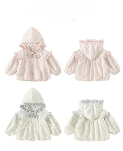 Detailed view of floral hooded jackets in pink and grey with cute bow and ruffle accents