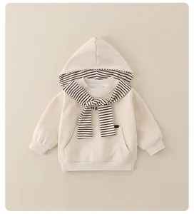 Detail of baby hoodie with striped hood lining and decorative matching scarf knot