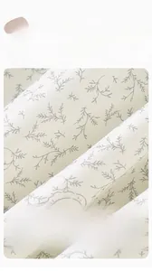 Macro detail of breathable combed cotton fabric with gray leaf pattern for toddlers