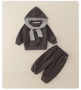 Detail view of children gray hoodie with striped lining and matching joggers set