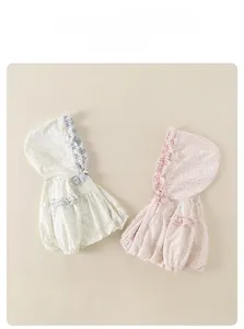 Detail of baby girl hooded floral jackets with lace trim and delicate bow accents