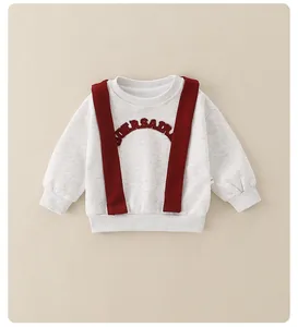 Detail of grey baby sweatshirt with red strap embroidery and ribbed cuffs