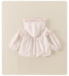 Close-up of pink floral baby hoodie with lace trim and ruffle shoulder details
