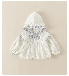 Detail of girls' floral hooded jacket with lace trim, bows and elastic hem accents