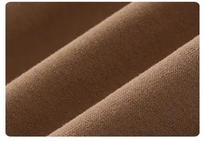 Close-up of brown knit fabric showing soft texture and premium weaving details