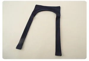Detail of navy blue knit bolero sleeves for kids with fine texture and ribbed cuffs
