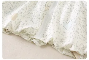 Detail of baby girl floral jacket with cute heart prints and soft elastic hem