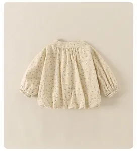 Detailed close-up of cute floral print cotton jacket with elastic cuffs for baby girls