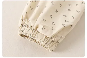 Close-up of elastic cuffs on a baby girl floral cotton jacket with vintage flower pattern