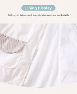 Detail of soft fleece lining and striped pocket on a white toddler spring jacket