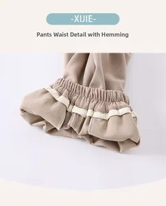 Detailed view of elastic waistband with piping and stitching for toddler boys trousers