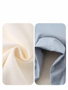 Detail of breathable soft knitted rib fabric and smooth light blue cotton for toddler outfits