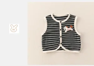 Detail of baby boys' striped cotton vest with elegant button closure and pony embroidery