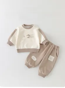 Detail view of baby two-piece tracksuit with cute puppy embroidery and A-grade soft cotton