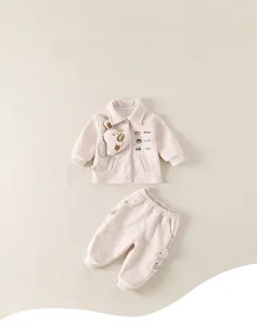 Detail of baby autumn two-piece set with 3D teddy bear doll and letter prints