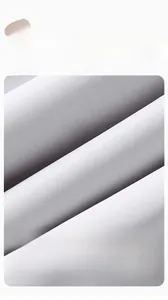 Close-up of soft grey combed cotton fabric showing breathable anti-pilling texture