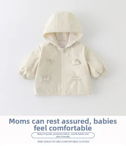 Detailed view of baby girl jacket with 3D cartoon cat and rabbit embroidery patches